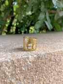 gold layered band statement ring with pear cut zircon sparing ring