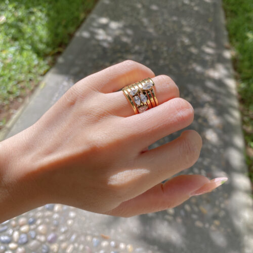 gold layered band statement ring with pear cut zircon sparing ring