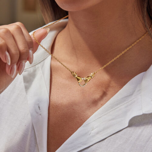 gold hand necklace with zircon accents in 18k gold plated stainless steel