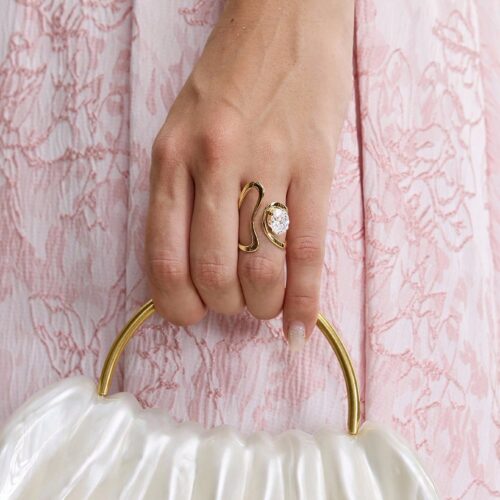 Abstract gold statement ring with oval zirconia stone