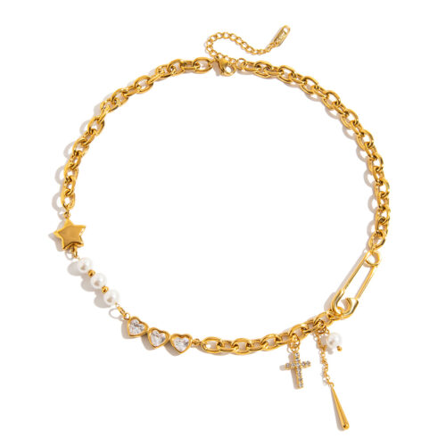 Gold safety pin necklace with pearl accents, heart cubic zirconia links, cross charm, star pendant, and chunky chain details