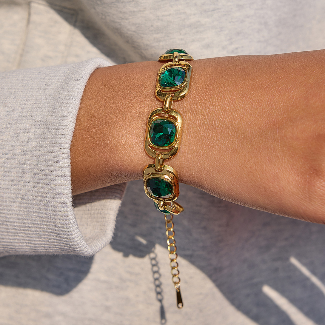 Mara green CZ bracelet worn with gold jewelry