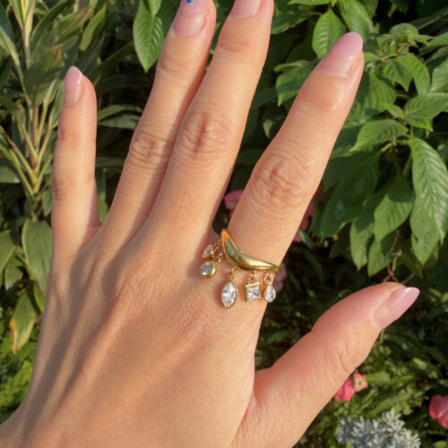 Golden Wishes gold CZ dangle ring with five sparkling cubic zirconia charms in heart, round, pear, marquise, and square shapes.