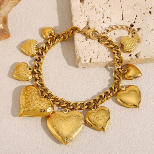 Cherie gold heart locket charm bracelet with chunky chain and multiple textured heart pendants