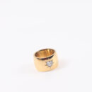 Chunky gold heart ring with sparkling cubic zirconia and starburst accents