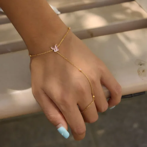 Rosie pink butterfly hand chain bracelet in gold-tone stainless steel with pink cubic zirconia accents